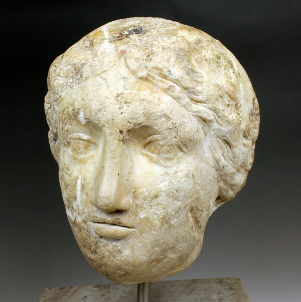 Roman female head reused later as weight