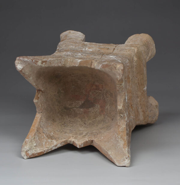 Roman four-horned votive altar with a swastika painted on top